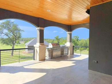Discover this exceptional Hill Country luxury home situated on 5