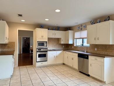Location, Location, Location! This beautiful garden home is - photo 10
