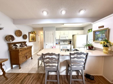 Welcome to this 3 BR/2 BA end unit on a corner cul-de-sac lot