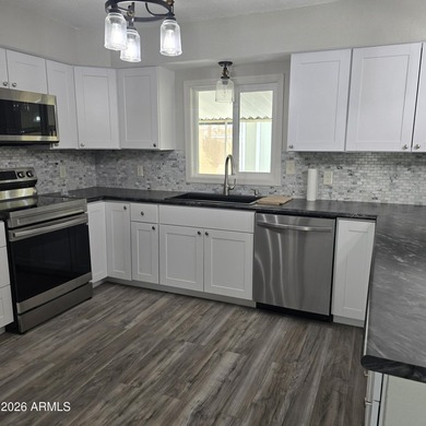 ON LEASED LAND: This home is absolutely gorgeous!! It has been - photo 3