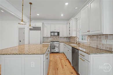 Located within the prestigious Ford Field and River Club in the - photo 15