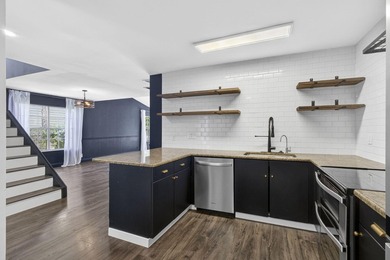 Spacious townhouse with Brand New Roof, newer plumbing, and new - photo 10