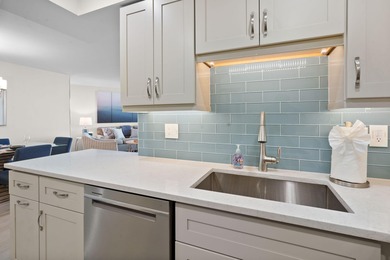 Indulge in luxury coastal living with this bright and - photo 14