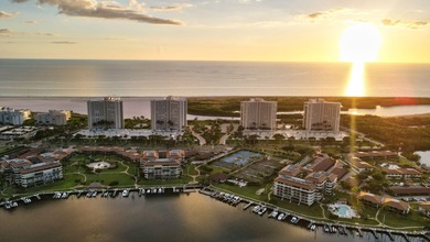 Indulge in luxury coastal living with this bright and - photo 37