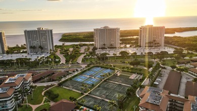 Indulge in luxury coastal living with this bright and - photo 44
