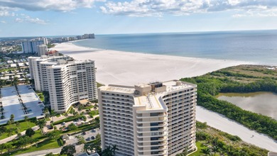Indulge in luxury coastal living with this bright and - photo 55