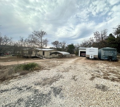 JUST UNDER ONE ACRE! With a spacious 2-bedroom, 2-bath