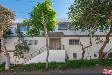 Just steps from the sand, this beautiful triplex sits on a prime - photo 1