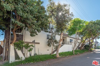 Just steps from the sand, this beautiful triplex sits on a prime - photo 2