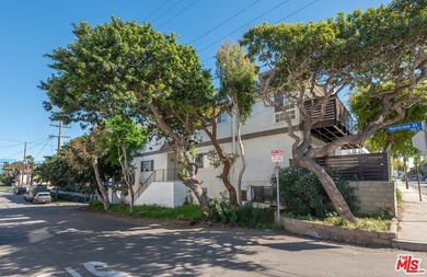 Just steps from the sand, this beautiful triplex sits on a prime - photo 3