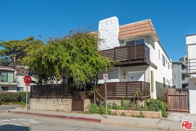 Just steps from the sand, this beautiful triplex sits on a prime - photo 4