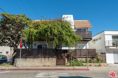 Just steps from the sand, this beautiful triplex sits on a prime - photo 5