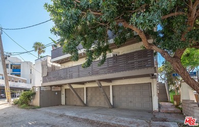 Just steps from the sand, this beautiful triplex sits on a prime - photo 6