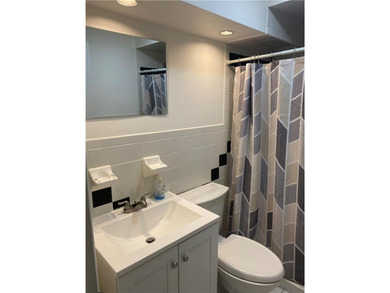 Welcome to Narragansett Village! This first-level condo features - photo 16
