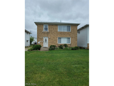 Charming Euclid Brick Duplex. The property at 535-537 E 208th St - photo 1