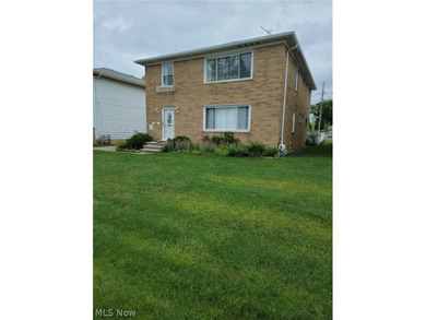 Charming Euclid Brick Duplex. The property at 535-537 E 208th St - photo 2