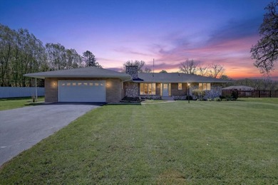 All-brick home offering space and comfort throughout! Features a - photo 3