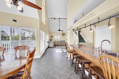 Located on a spacious waterfront lot in Bay St. Louis, this - photo 11