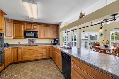 Located on a spacious waterfront lot in Bay St. Louis, this - photo 15