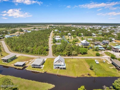 Located on a spacious waterfront lot in Bay St. Louis, this - photo 39