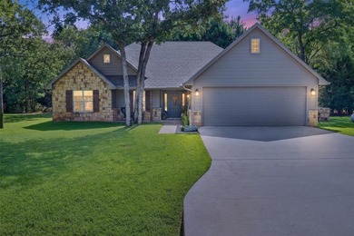 Located on three premium wooded lots in the gated community of - photo 1