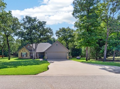 Located on three premium wooded lots in the gated community of - photo 3