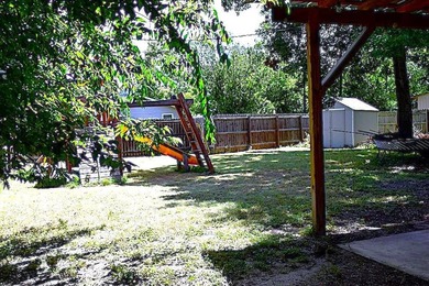 Welcome home to this delightful 3-bedroom, 2-bath cottage-style - photo 4
