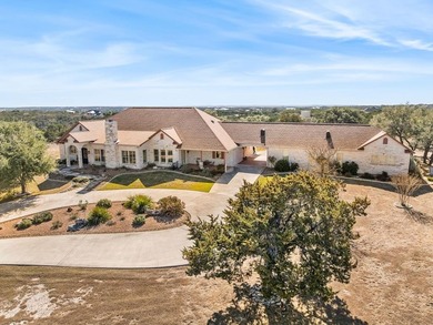 This sprawling one-story custom stone home sits on 4.33 acres of