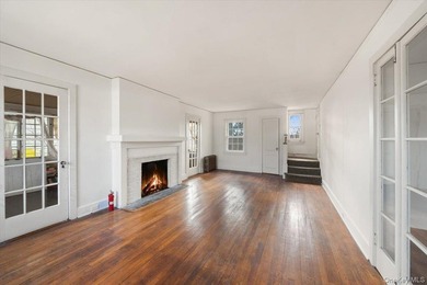 This classic Dutch Colonial house is set on an extra-large lot - photo 3