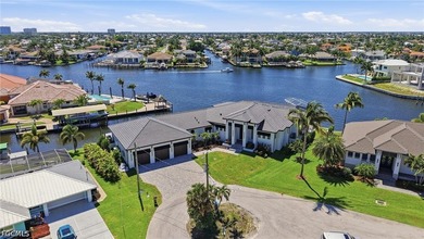 ULTIMATE GULF ACCESS MASTERPIECE WITH INTERSECTING CANAL VIEWS - photo 1