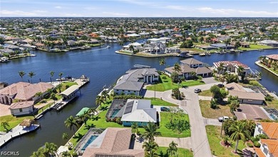 ULTIMATE GULF ACCESS MASTERPIECE WITH INTERSECTING CANAL VIEWS - photo 3