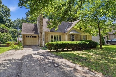 Tucked along one of Fairway's charming tree-lined streets in the - photo 3