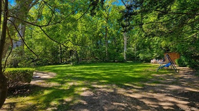Set on a level half-acre along one of Cold Spring Hills' most - photo 26