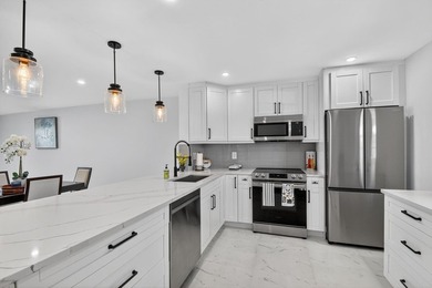 * BLDG is FHA APPROVED. Beautifully renovated 2nd-floor corner - photo 3