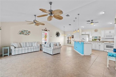 Welcome to your coastal paradise! This ELEVATED canal home with - photo 11