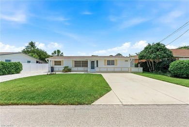 This charming Florida bungalow sits along the Imperial River, is - photo 2