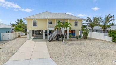 Welcome to your coastal paradise! This ELEVATED canal home with - photo 32