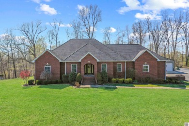 This totally remodeled lake area home with new swimming pool is - Lake Home For Sale in Calvert City, Kentucky