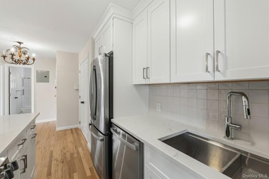 Welcome home to this beautifully renovated top-floor, walkup - photo 8