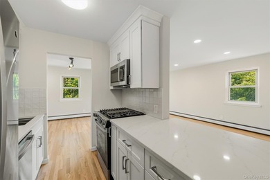 Welcome home to this beautifully renovated top-floor, walkup - photo 9