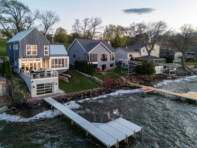 Lakefront luxury meets architectural distinction in this - photo 5