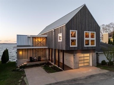 Lakefront luxury meets architectural distinction in this - photo 8