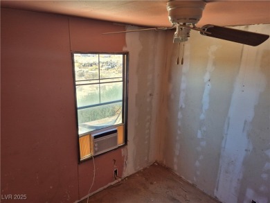 Fixer Upper with Huge Potential on 1.1 Acres in Pahrump!  Bring