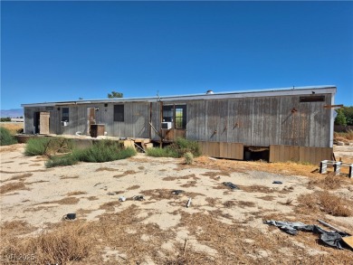 Fixer Upper with Huge Potential on 1.1 Acres in Pahrump!  Bring