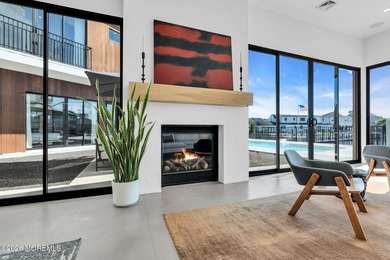 A rare modern waterfront retreat, this architect-designed home - photo 9
