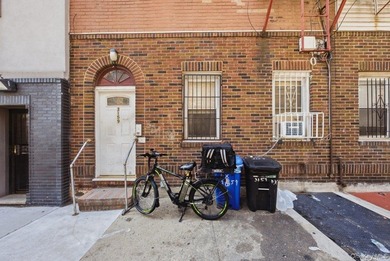 Brick 3-family home in the Grand Concourse featuring three - photo 1