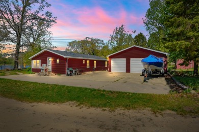 Experience lakeside living at its finest with this charming - Lake Home For Sale in Paw Paw, Michigan