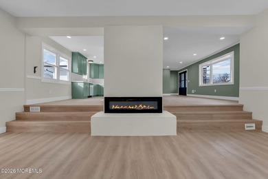 Welcome home to this beautifully remodeled ranch where modern - photo 3