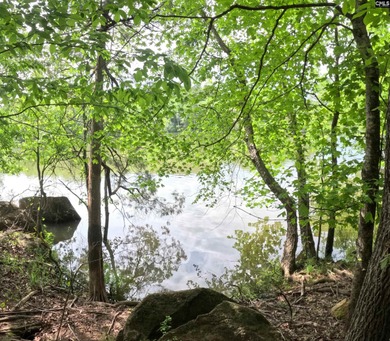Your lakeside retreat awaits! This 1.78 acre waterfront lot on - photo 9