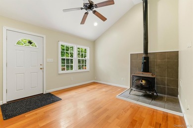 Nestled at the end of a quiet road, this move-in ready home - photo 1